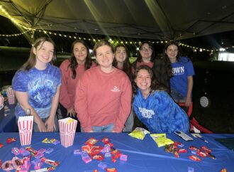 Etown students enjoy outdoor movie night on The Dell
