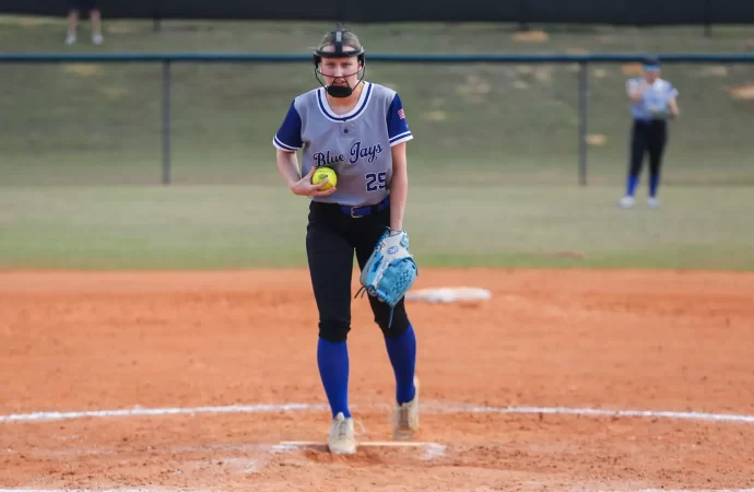 Softball splits with second-place Catholic as Sydney Harper throws complete game shutout