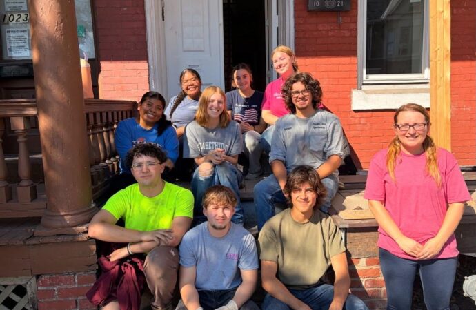 Students spend fall break restoring homes with Habitat for Humanity.